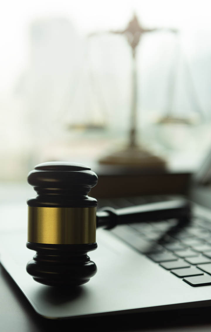 law legal technology concept. judge gavel and computer on desk of lawyer with legal icon.