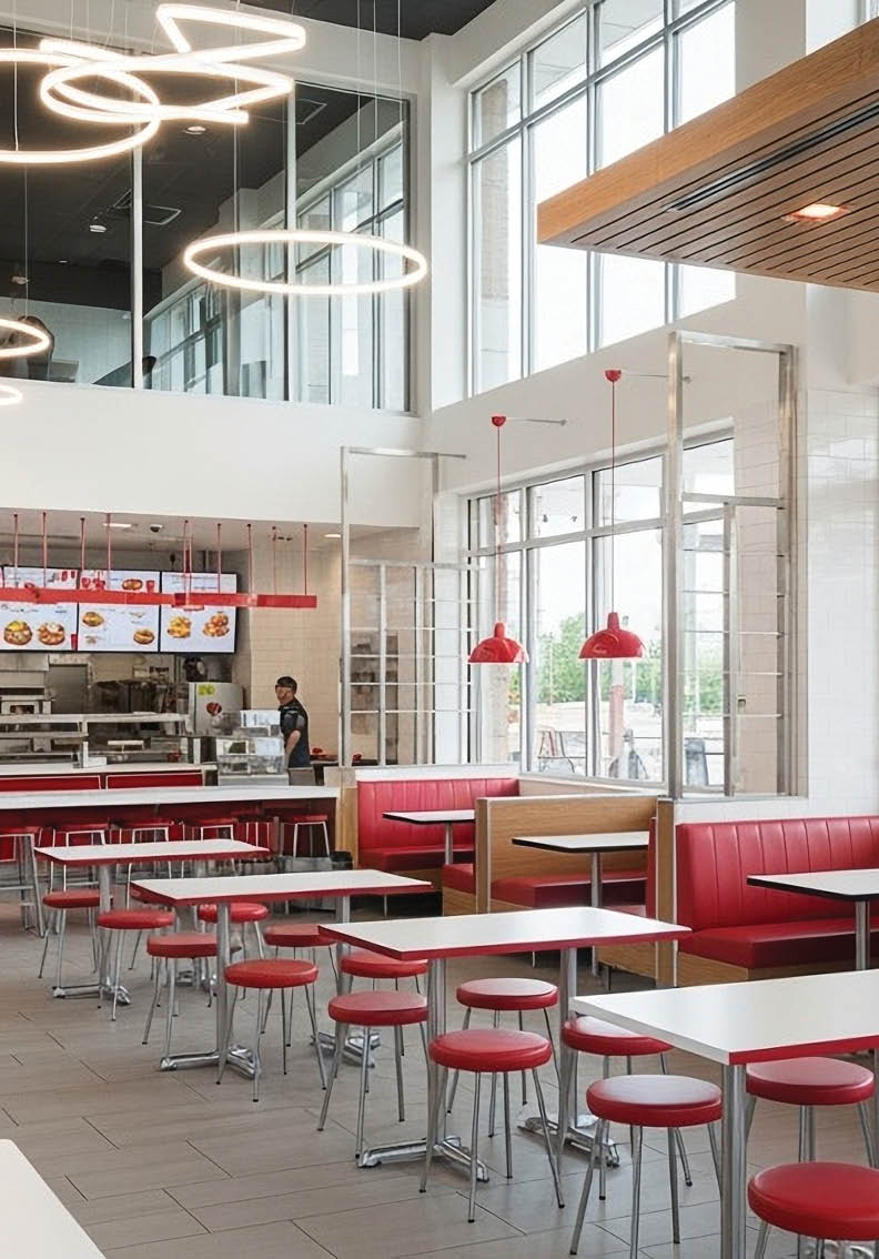 A restaurant with a large window and a red and white color scheme. AI generated content