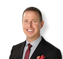 A man wearing a suit and tie is smiling for the camera. AI generated content