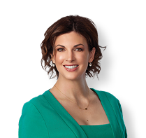 A woman wearing a green dress and a gold necklace. AI generated content