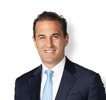 A man wearing a blue tie and a suit is smiling for the camera. AI generated content