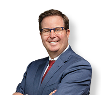 A man wearing a suit and tie is smiling for the camera. AI generated content