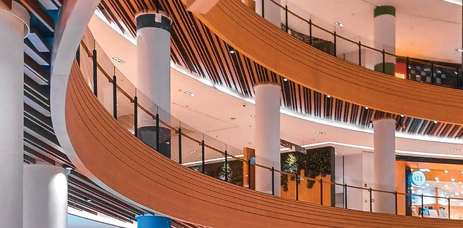 A large, open building with a spiral staircase and a glass ceiling. AI generated content