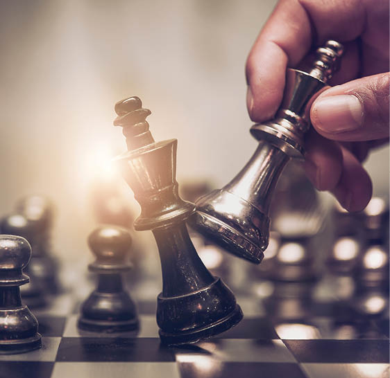 Businessman moving chess piece on chess board game concept for ideas and competition and strategy, business success concept, business competition planning teamwork strategic concept. 