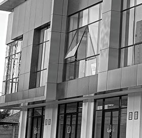 A row of luxury shophouses with a modern minimalist architectural design.